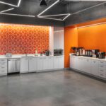 Geometric linear lighting and wall wash lighting installed at Waystar