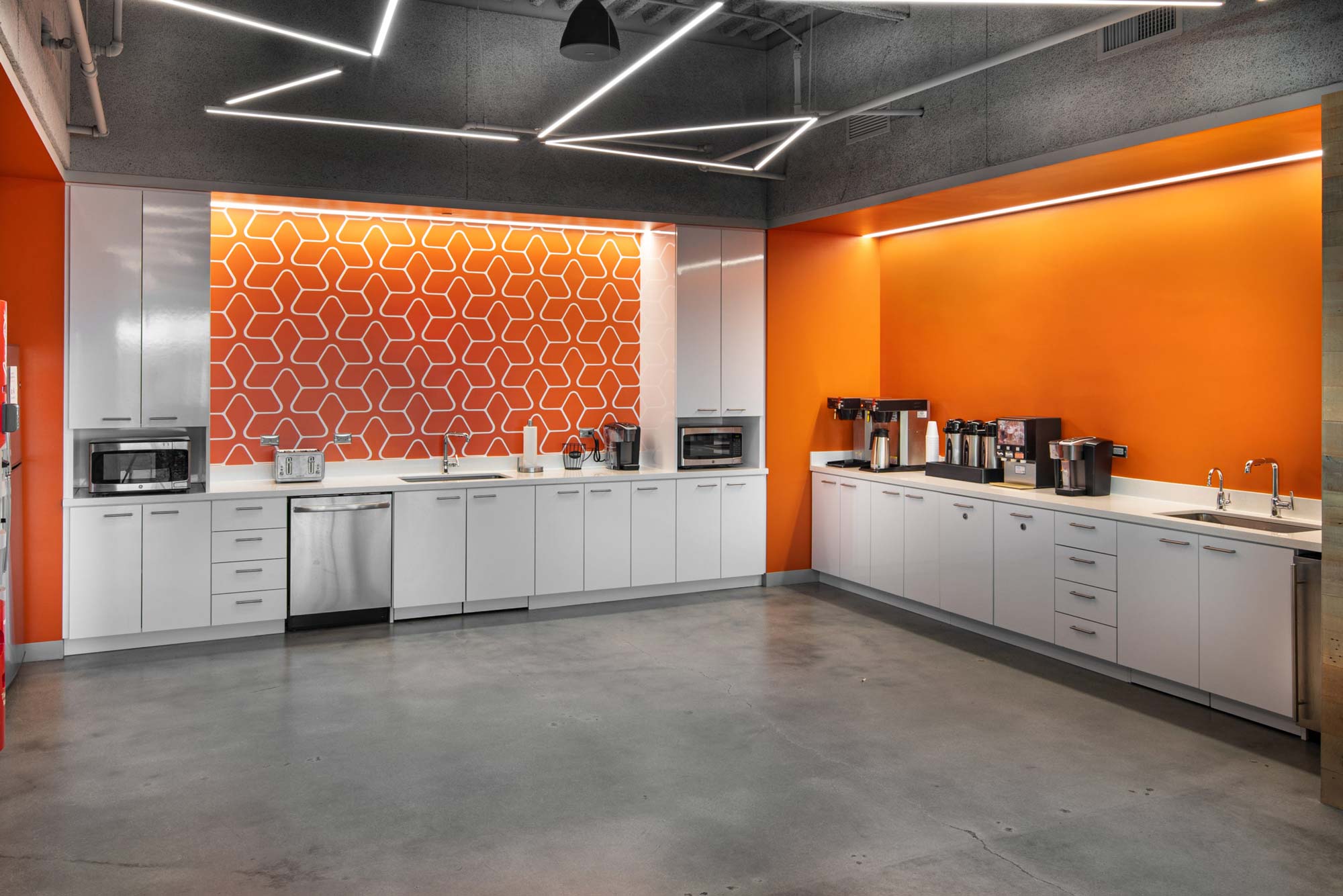 Geometric linear lighting and wall wash lighting installed at Waystar